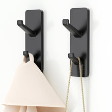 Load image into Gallery viewer, Self-Adhesive Wall Hooks - 4 Pack, Black Metal Coat &amp; Towel Hooks for Hanging: Hold 13 LB, Ideal for Bathrooms, Shower, Kitchen &amp; Doors