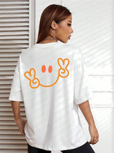 Load image into Gallery viewer, Minimalist Peace Sign Smile Graphic Tee | Bright Orange Happy Face on