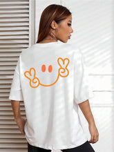 Load image into Gallery viewer, Minimalist Peace Sign Smile Graphic Tee | Bright Orange Happy Face on
